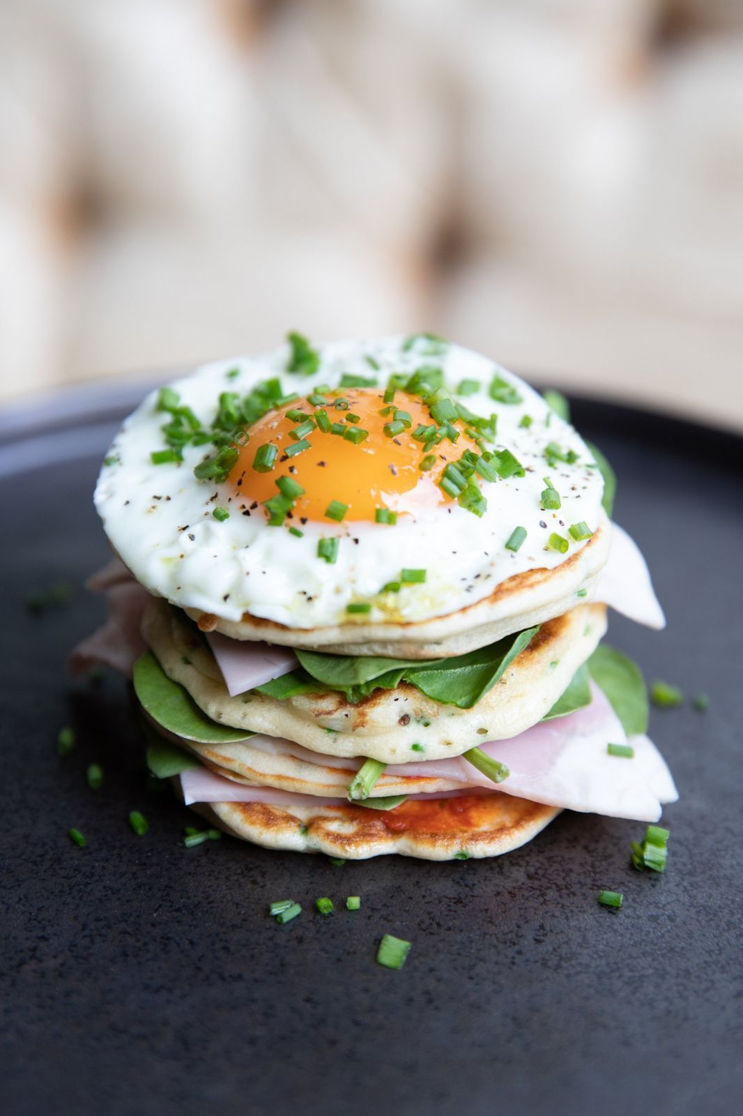 Pancake stack with ham, spinach and a fried egg