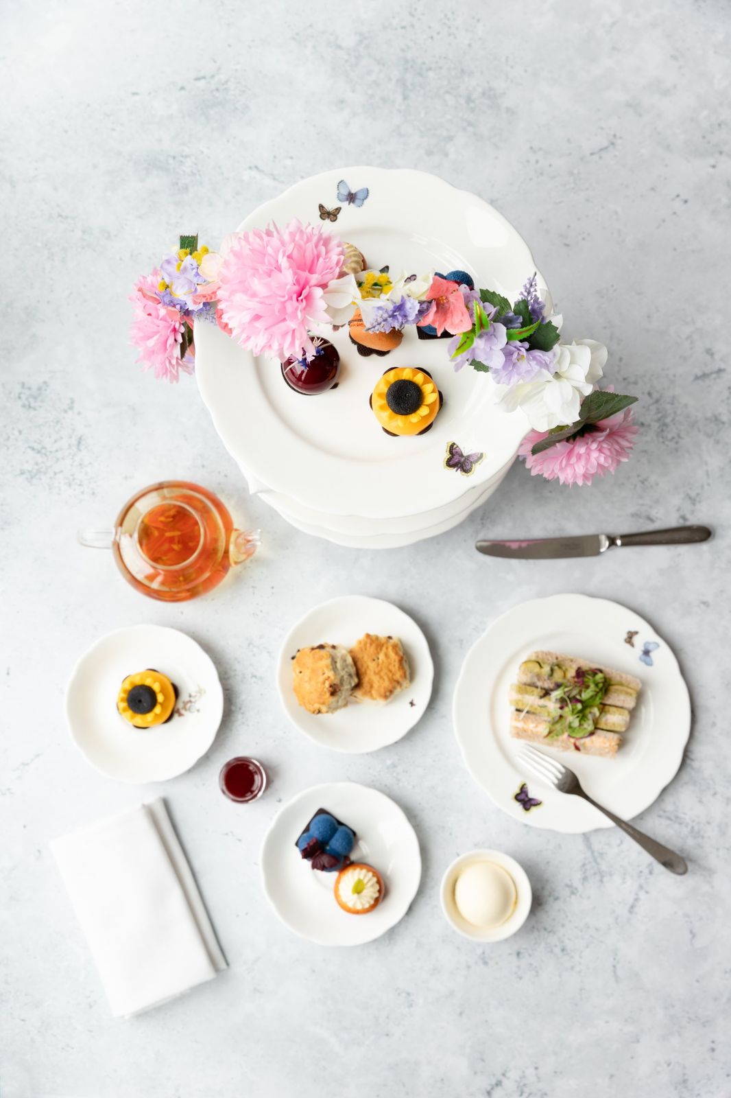 The Chelsea afternoon tea at The Athenaeum Hotel, laid out from above with flowers
