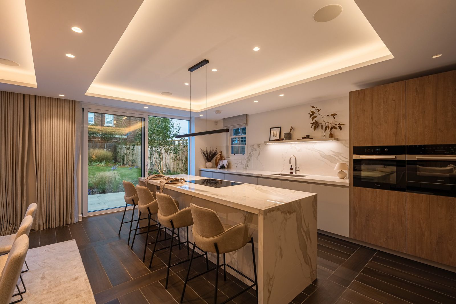 The kitchen island with doors open to the garden