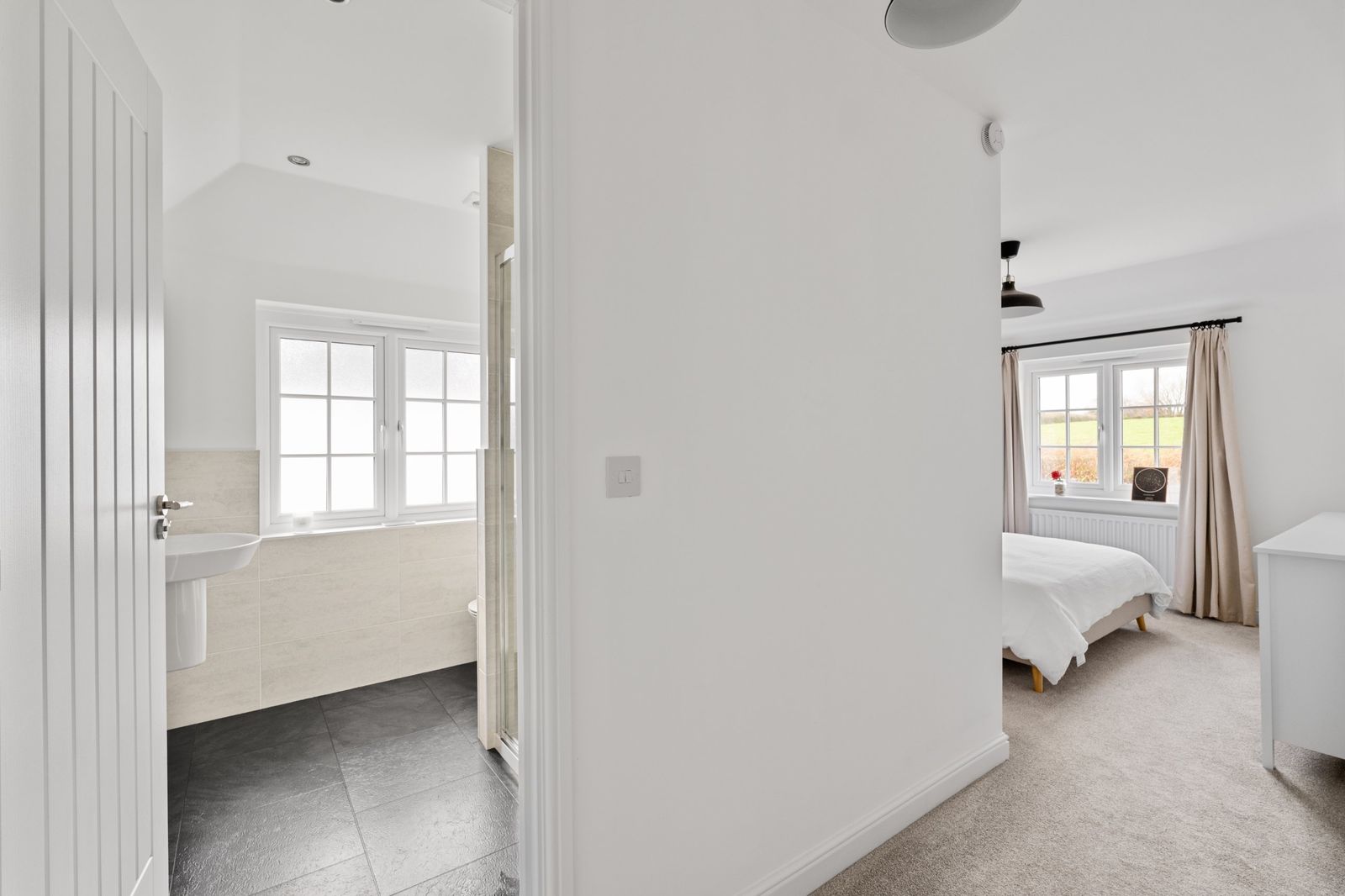 The landing looking into the en suite and main bedroom