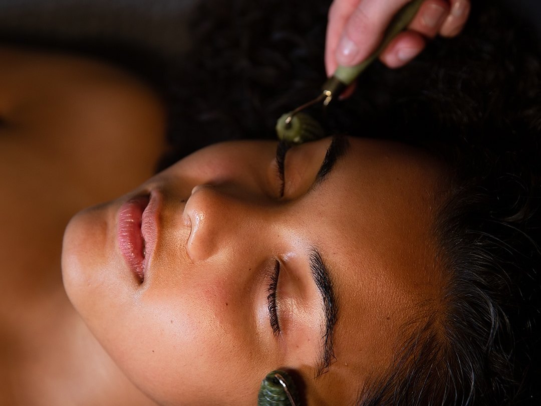 A facial with jade rollers in the spa