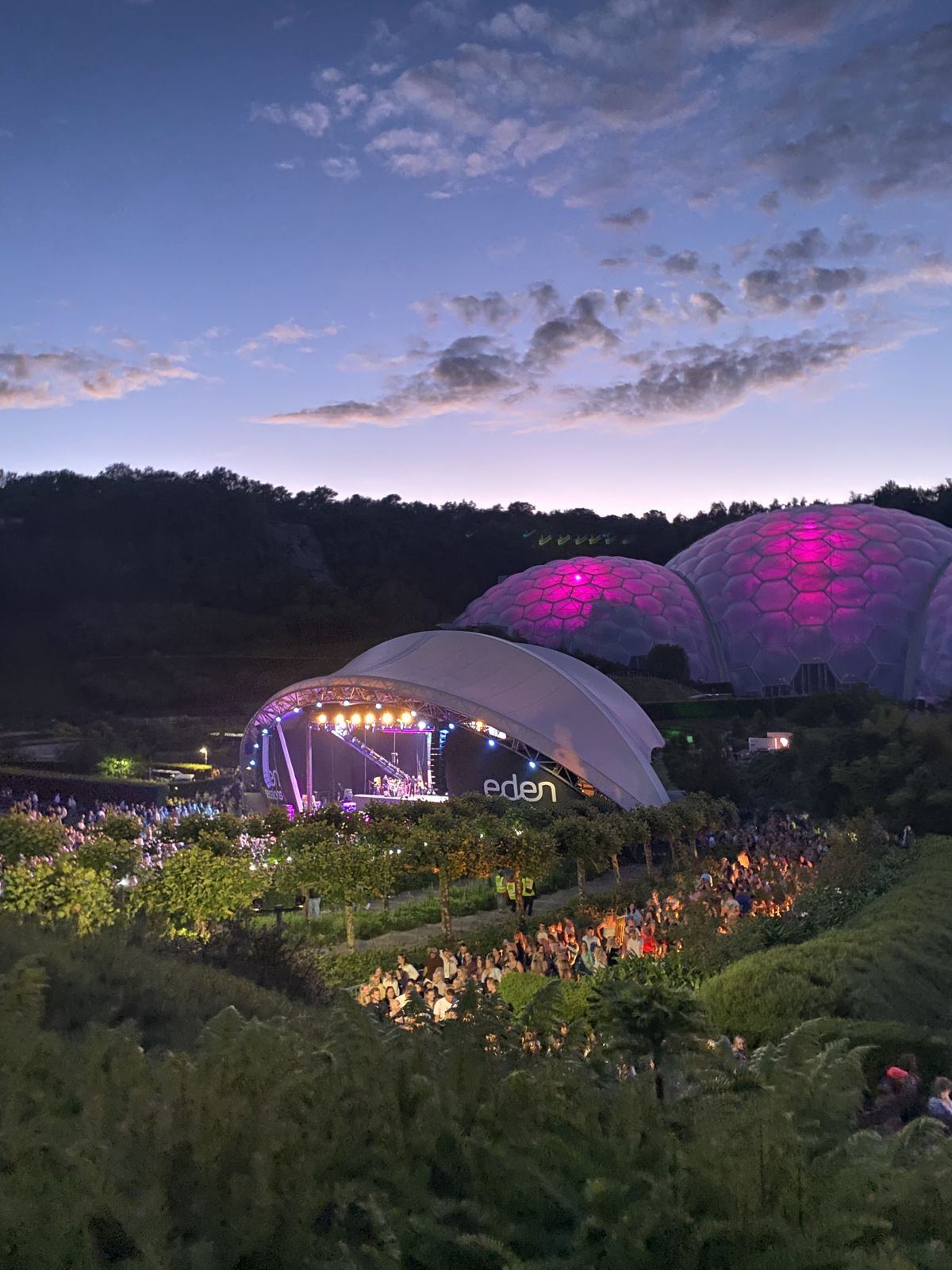 The Eden Project biomes lit up pink for an evening concert