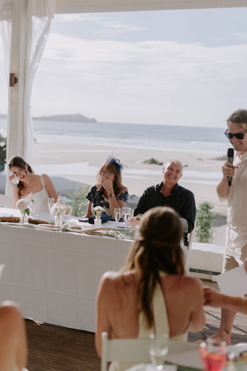 Guests laughing during the wedding speeches