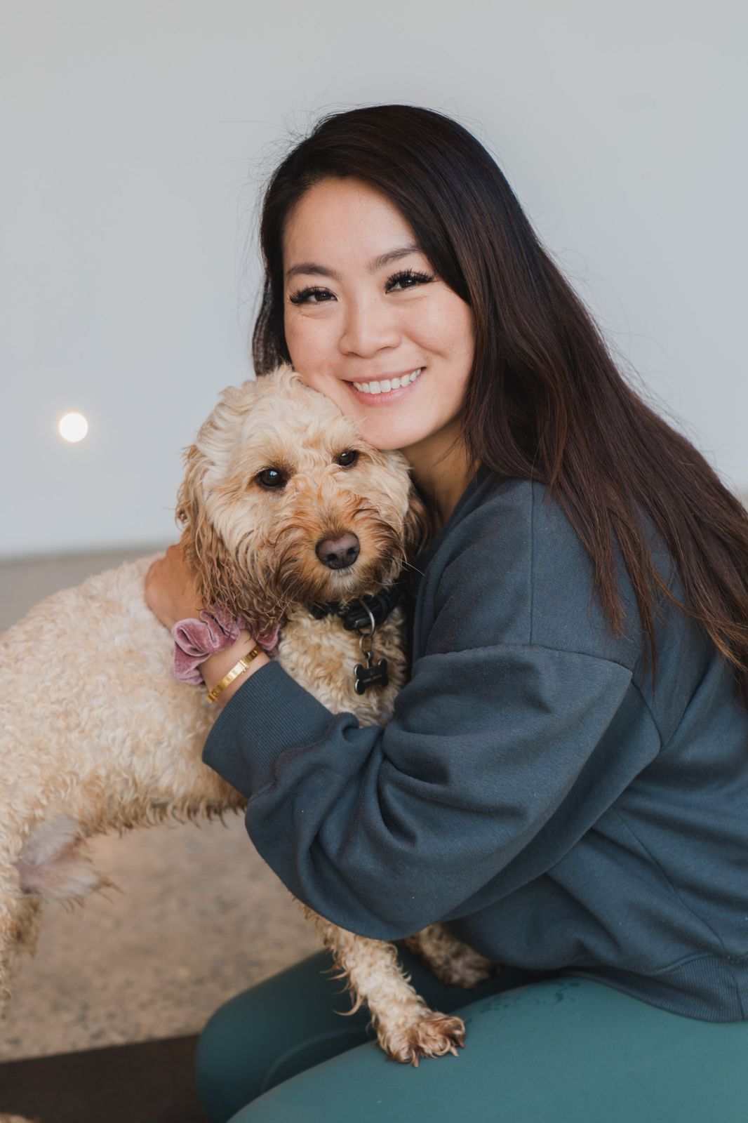 The retreat host hugging her dog