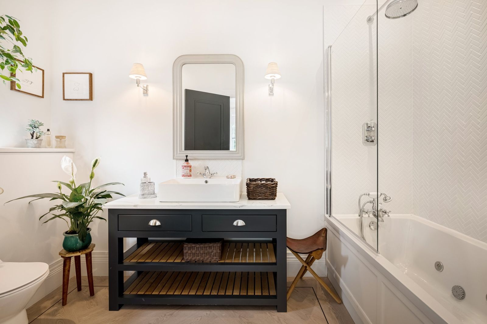 The family bathroom with a painted vanity and bath