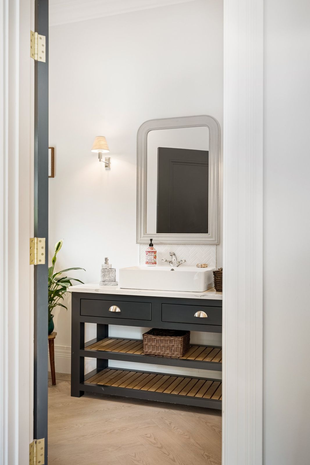 The bathroom vanity seen through the doorway