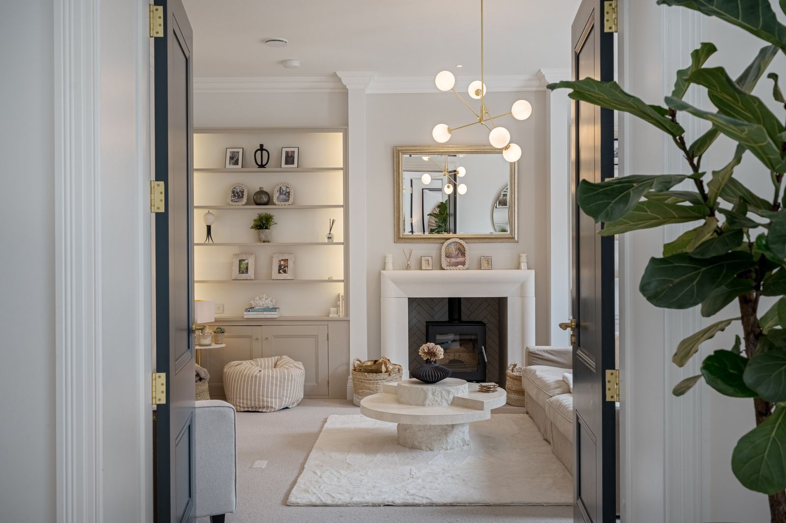 The sitting room seen through open double doors