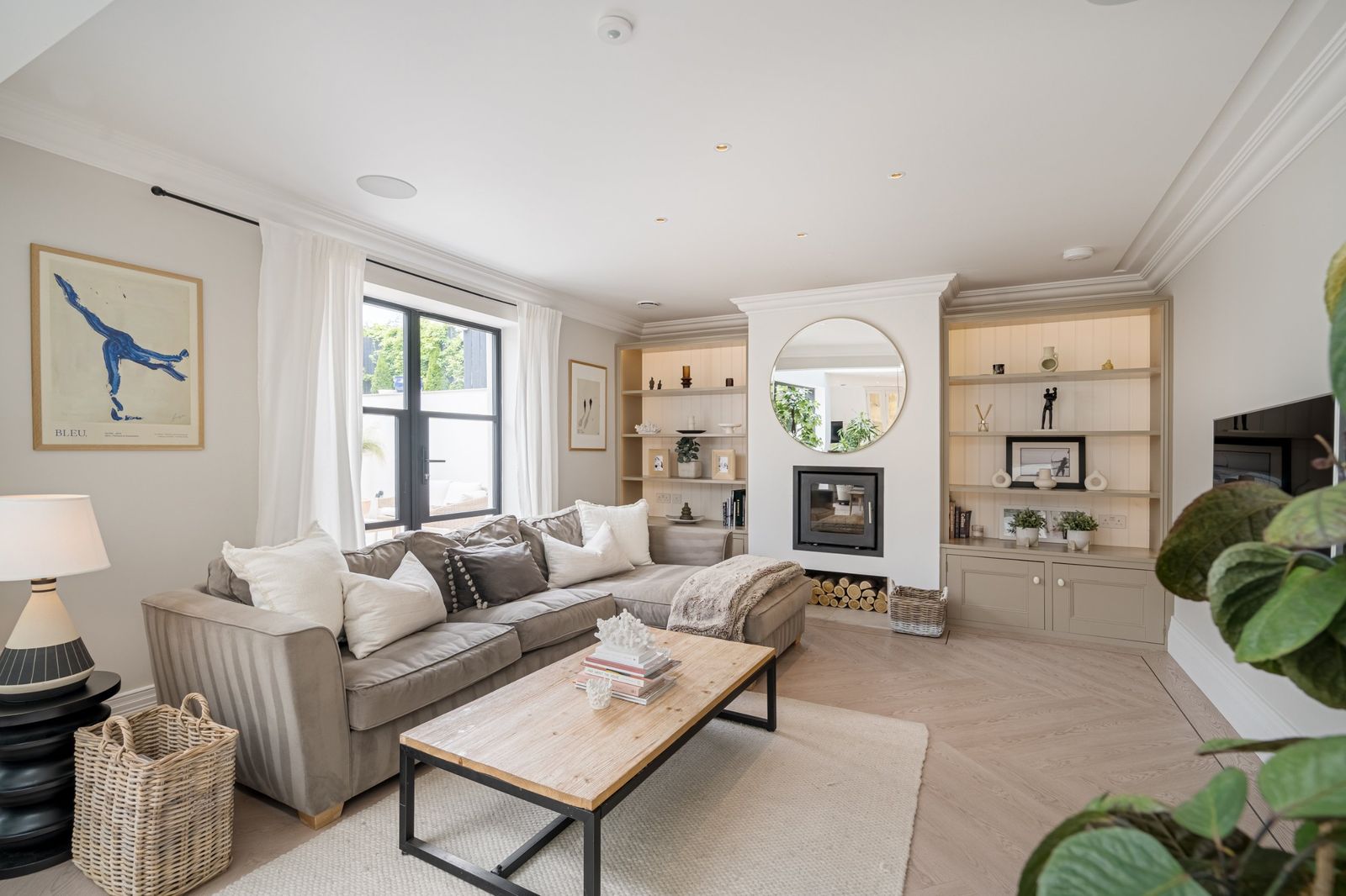 The snug with a corner sofa and wood burner