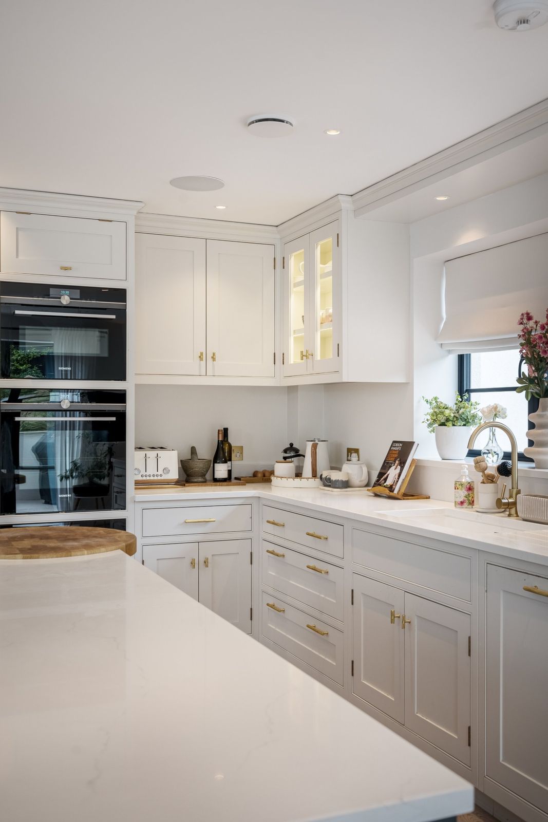 The kitchen corner with glass-fronted cabinets