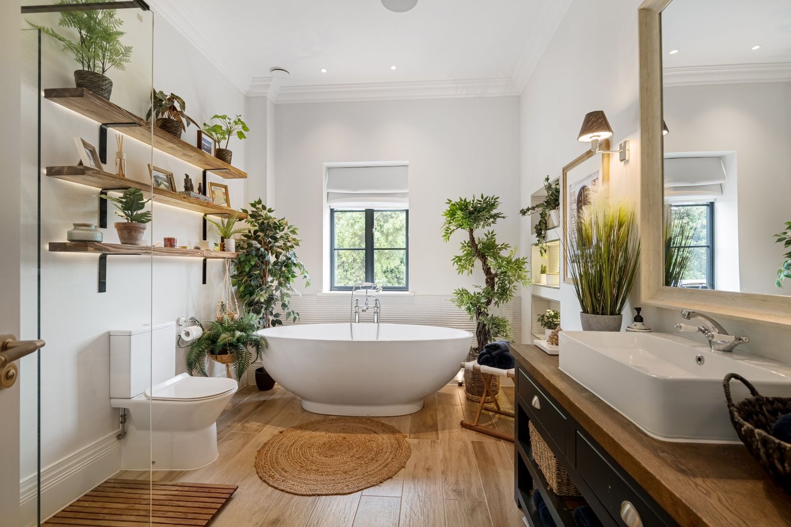 The family bathroom with a freestanding bath and plants