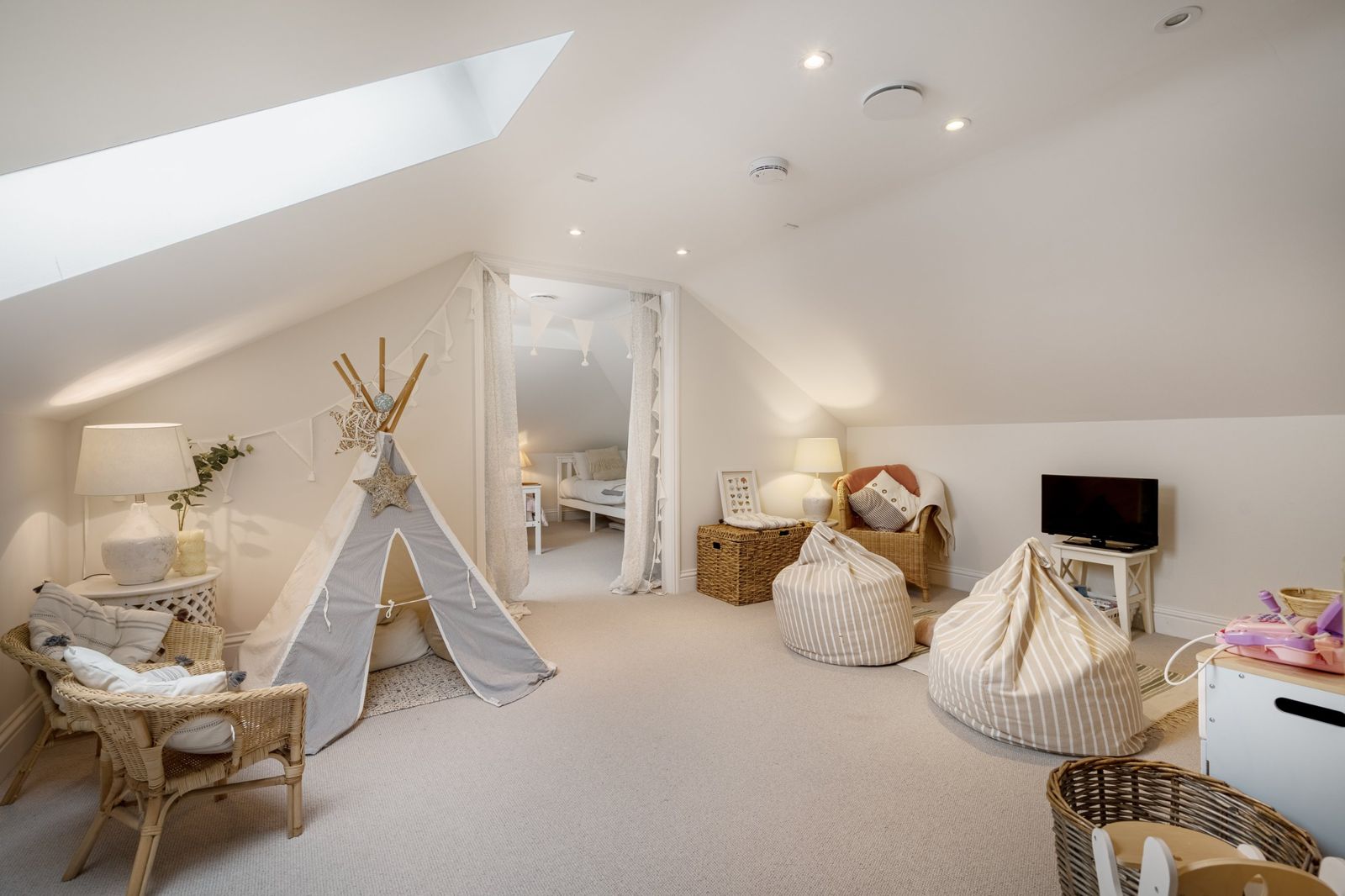 The loft playroom with a teepee