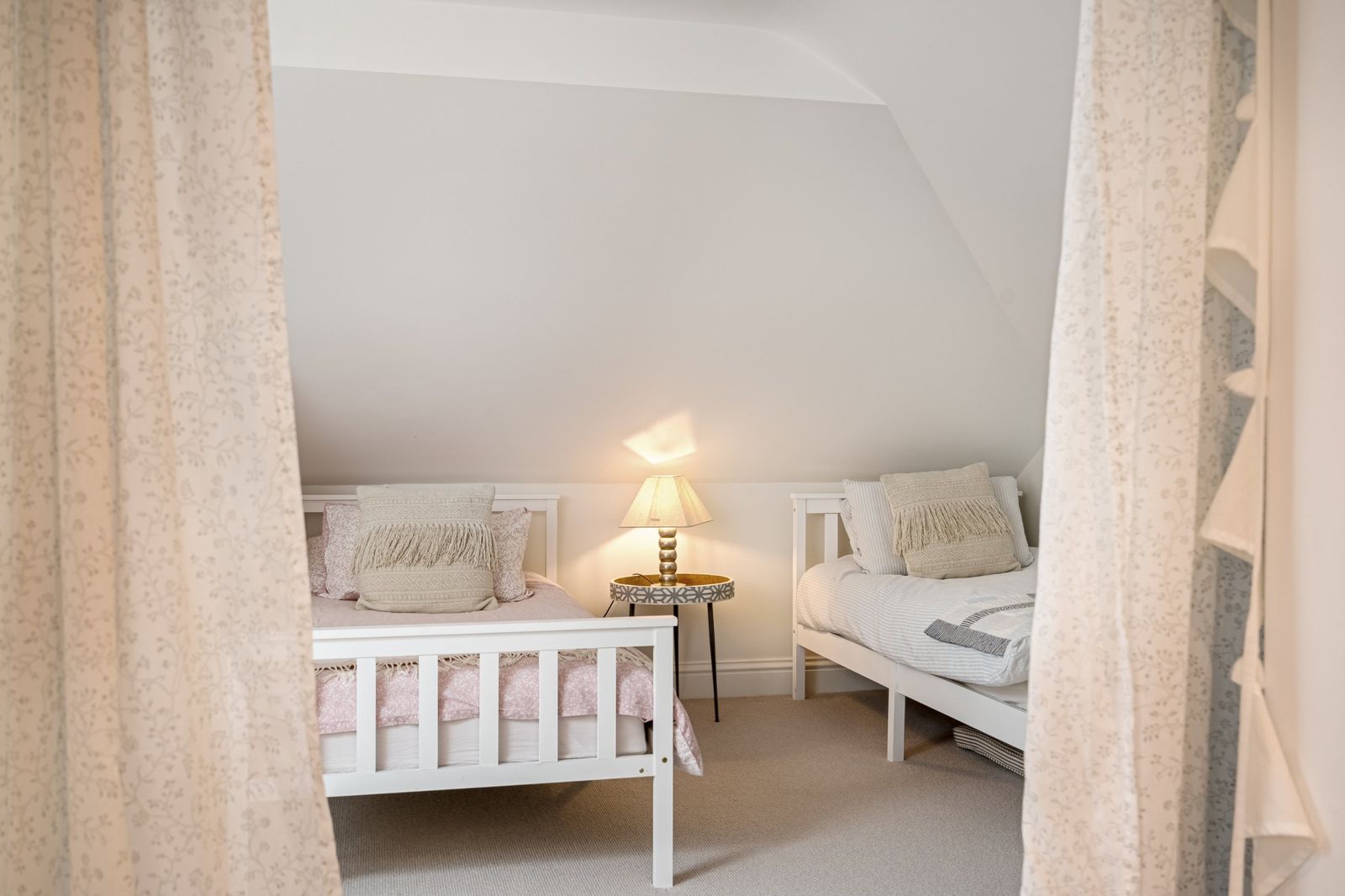 Twin beds tucked under the eaves